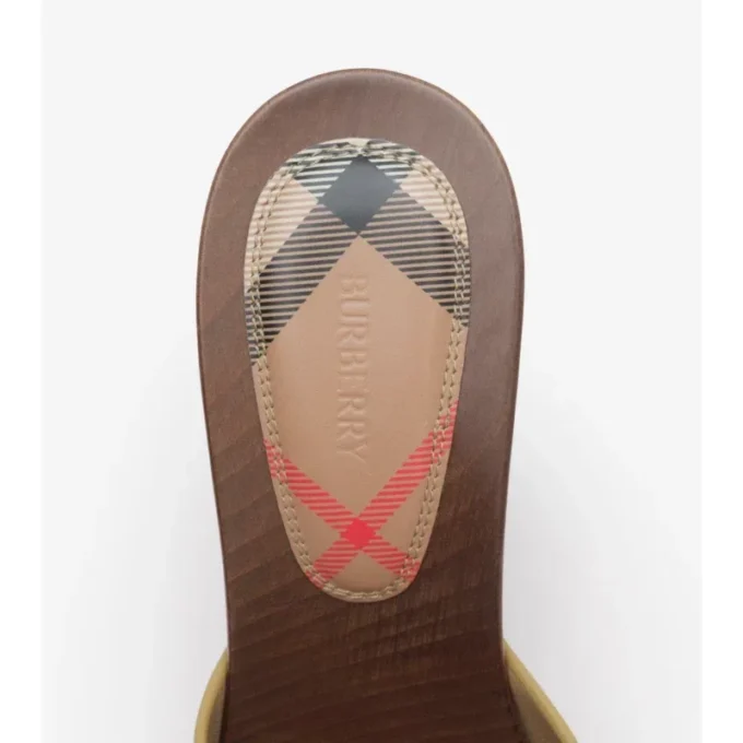 Mules Potter de piel con estampado de cuadros 