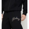 Pantalones de chándal de algodón con logotipo cursivo a cuadros