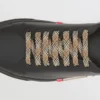 Zapatillas de cuero con detalle de rayas